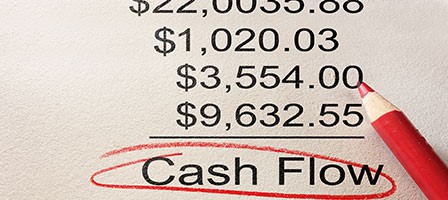 numbers lined up like a math problem with cash flow under it circled in red