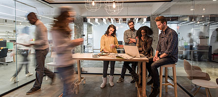 people working in a conference room 