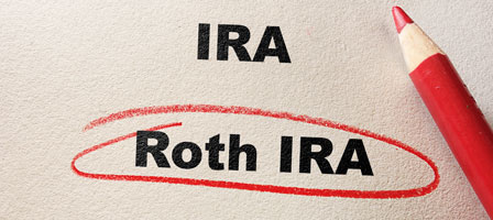 ira and roth ira written on a paper with roth ira circled in red