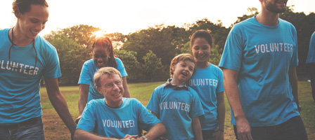 a group of people wearing volunteer shirts