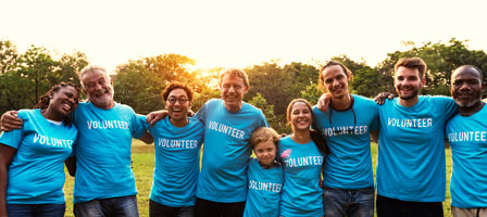 a group of people wearing voluntee shirts