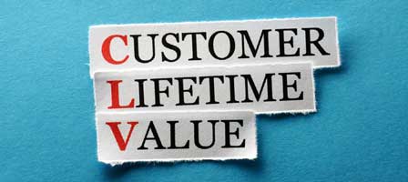 pieces of paper that spell out customer lifetime value