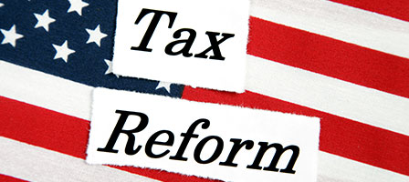 an american flag that says tax reform in front of it