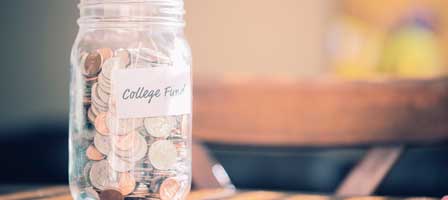 a jar of change that says college fund on it