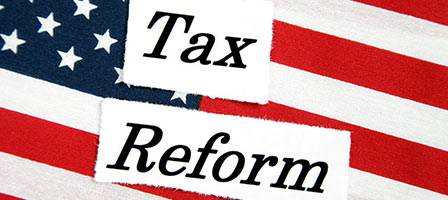 a flag with the words tax reform in front of them