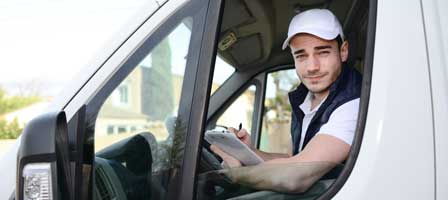 a man sitting in a work vehicle