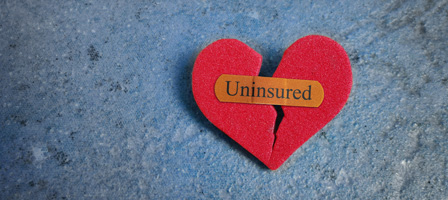 a broken heart with a bandaid that says uninsured on it