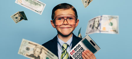 a kid in a suit with money falling around him and a calculator in his hand