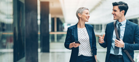 two people in suits talking 