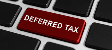 a button on a key board that says deferred tax